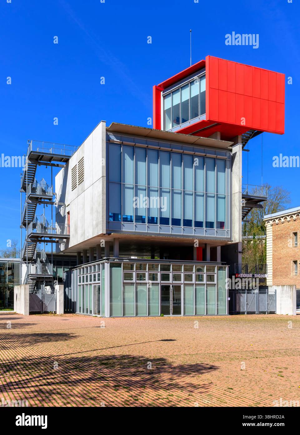 Tour Signal is a bright red, trapeziod-shaped building by architect ...