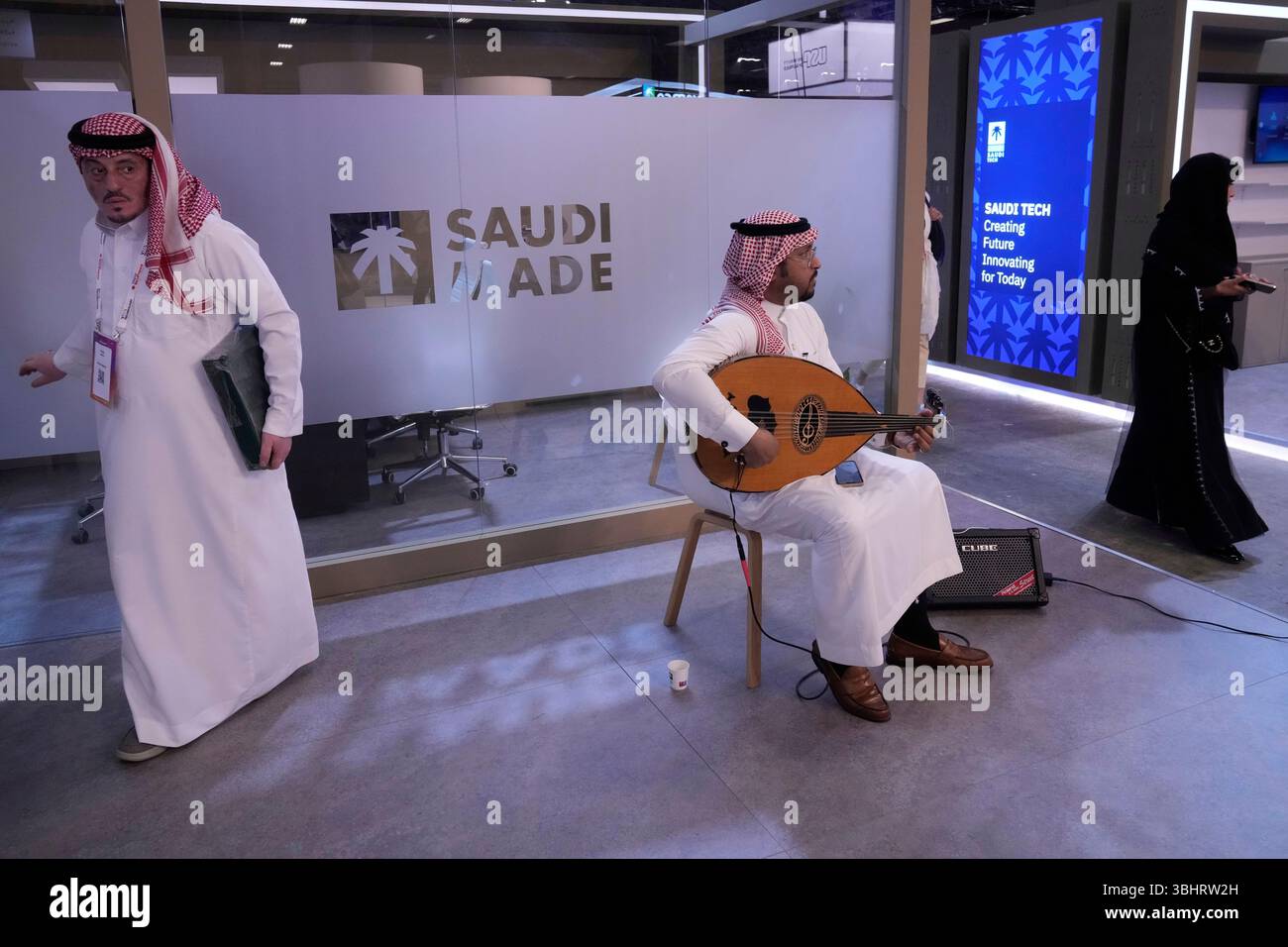 A man plays a music instrument at the Saudi Arabia pavillon at the ...