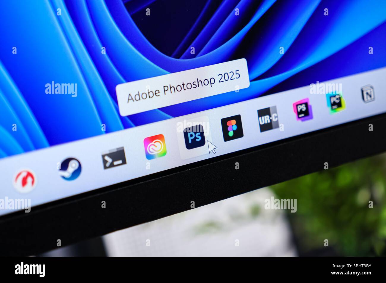 Poznan, Poland - June 6, 2025: Adobe Photoshop 2025 application icon on a desktop taskbar, showing user interaction with creative software Stock Photo