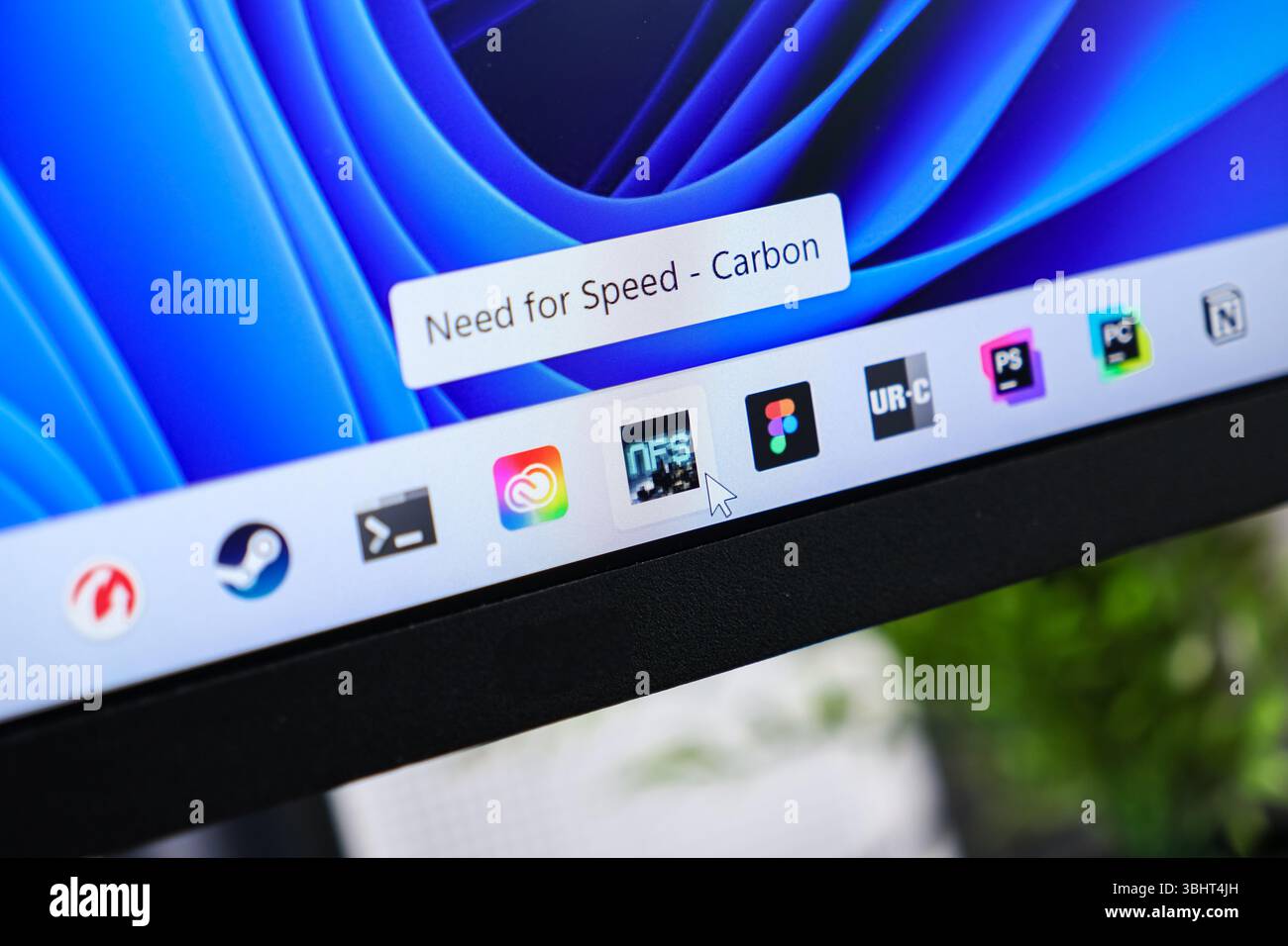 Poznan, Poland - June 6, 2025: Need for Speed - Carbon game application featured on a digital screen, a mouse cursor indicating its selection Stock Photo