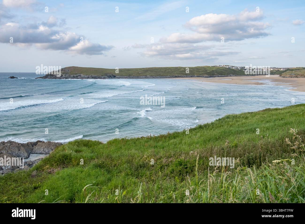 A view across the ocean to the Pentire Peninsula between Crantock and Newquay on the north Cornwall coast, England. Stock Photo