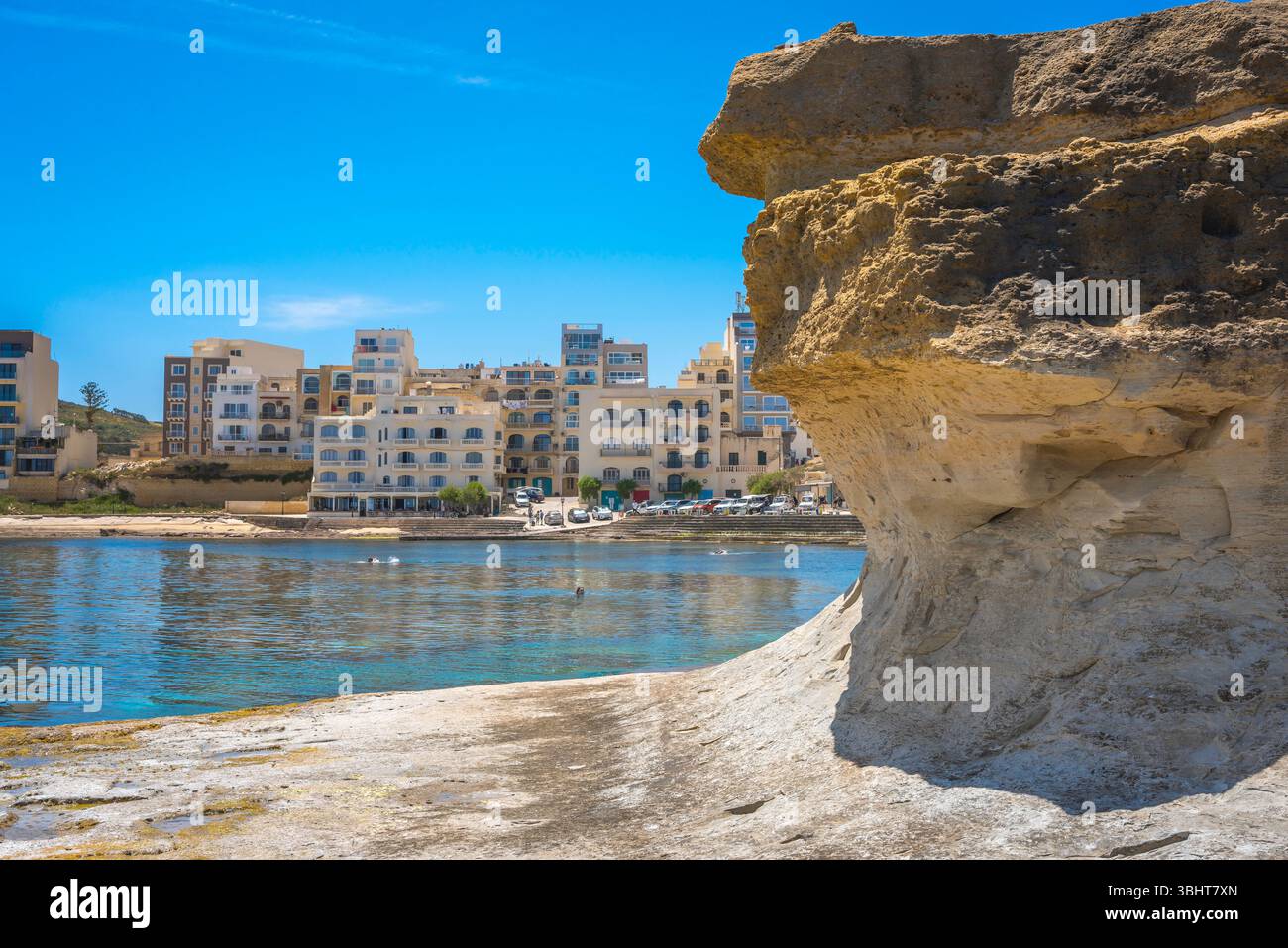 Qbajjar Gozo, view from Xwejni cliffs towards the coastal resort town of Qbajjar, Gozo Malta Stock Photo