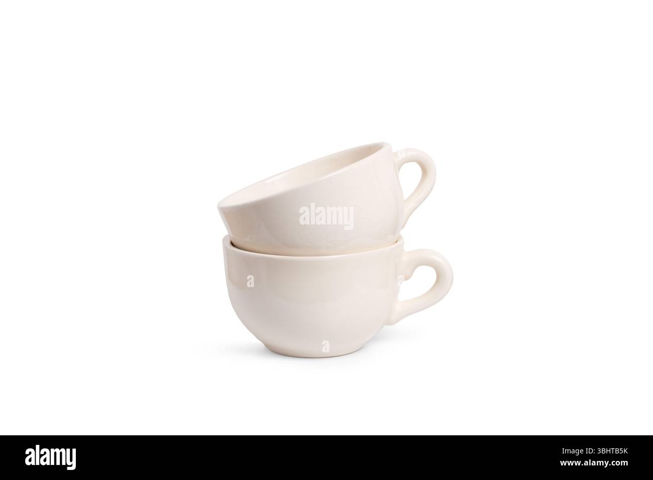 Two white cups isolated on a white background with copy space Stock Photo