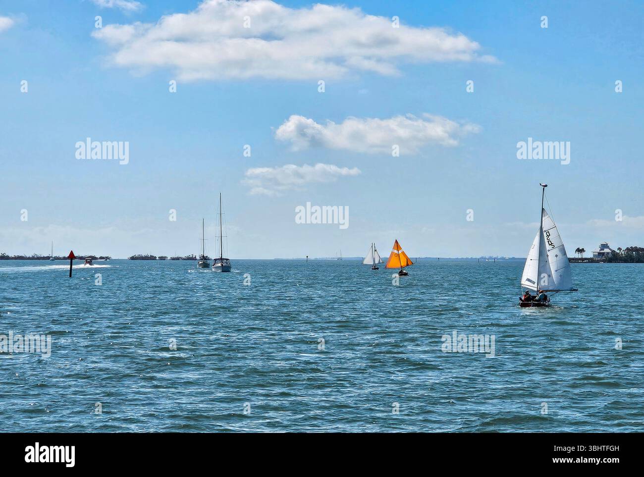 Recreational boaters on the Intracoastal Waterway in Gasparilla Sound off Cayo Costa, Florida. Sailboats make their way through the channel, while sai - Smartphone Captured Stock Image