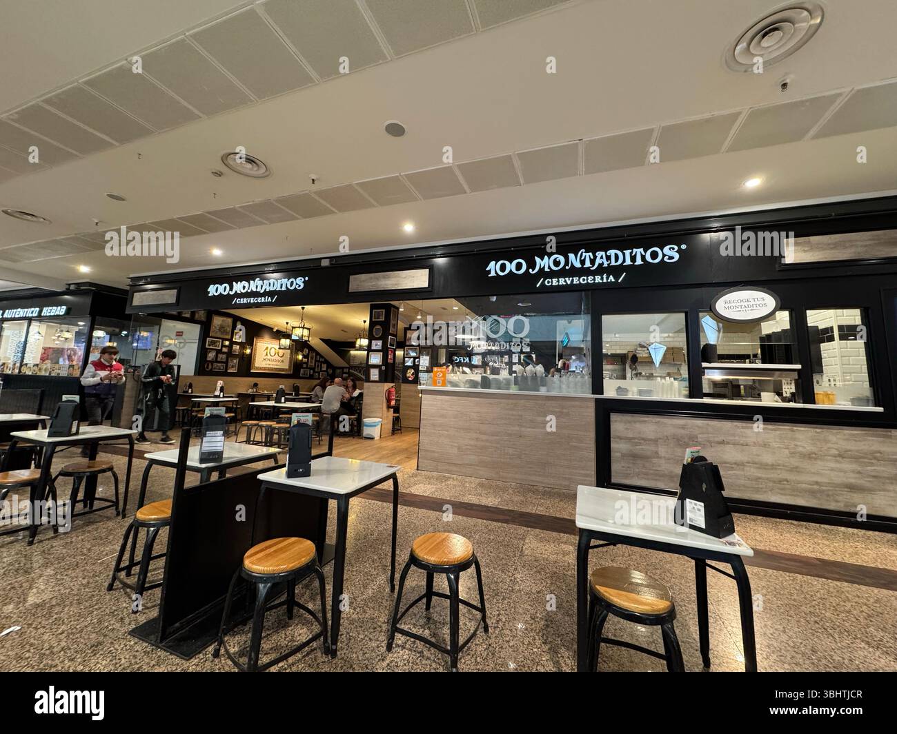 100 Montaditos restaurant in a mall in Madrid, Spain - Smartphone Captured Stock Image