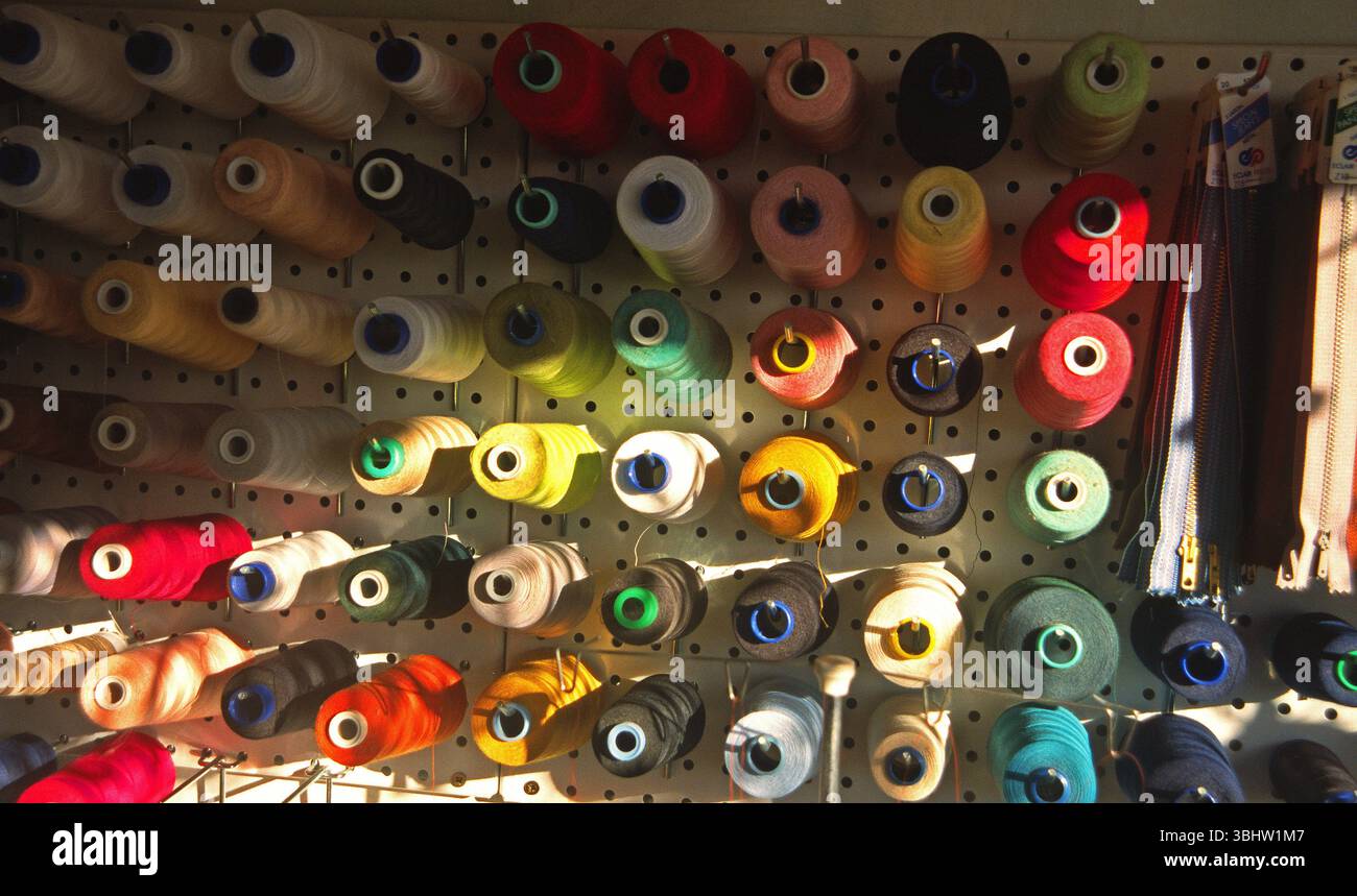 Spools of multi-colored threads in haberdashery in Provence. Stock Photo