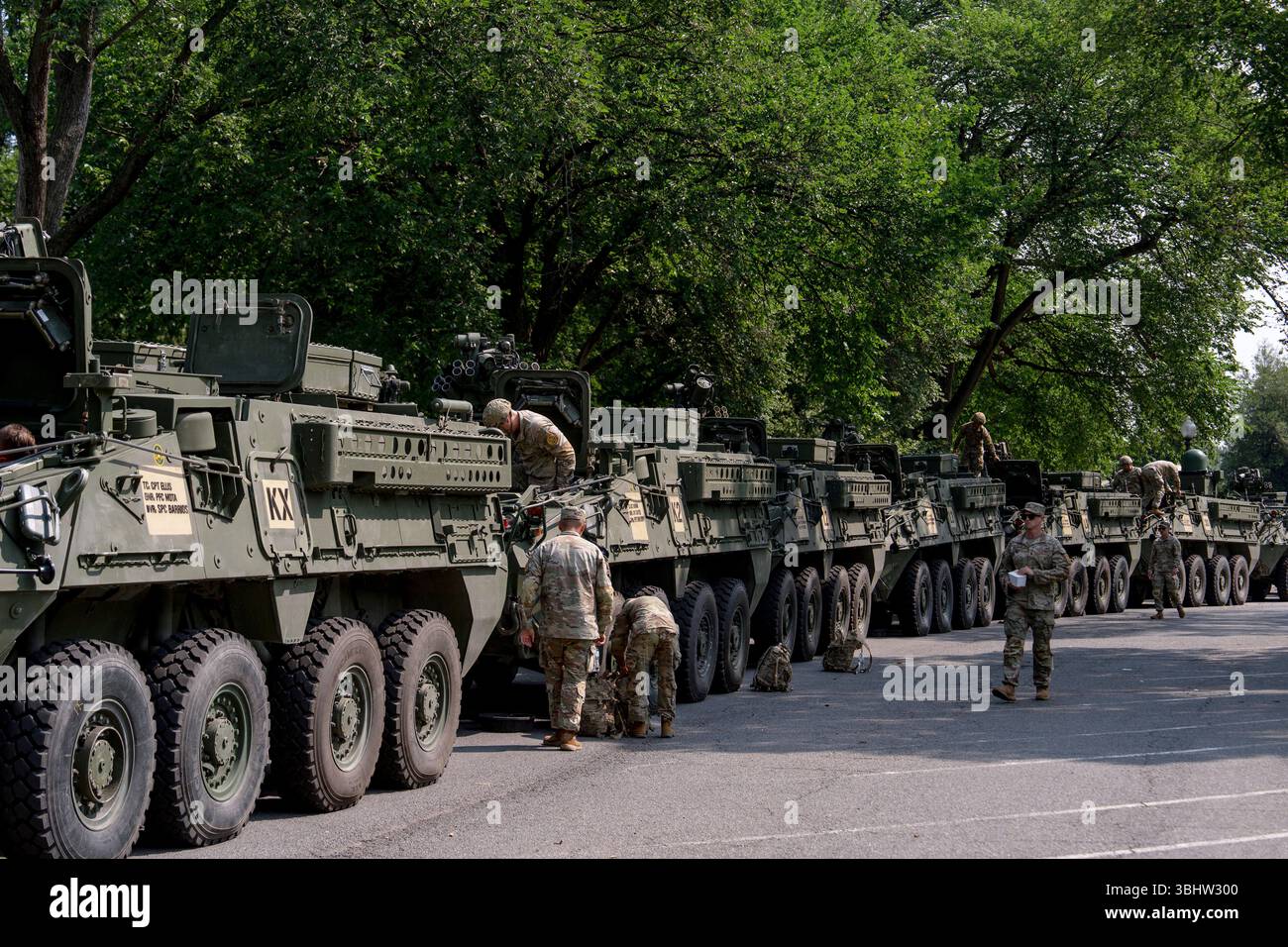 U.S. Army soldiers work on Stryker combat vehicles staged in West ...