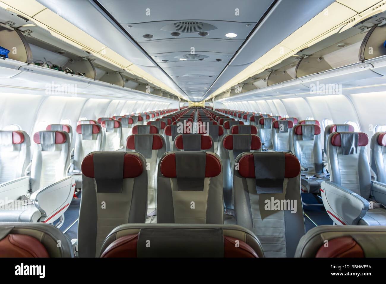 Inside empty wide body passenger airliner cabin Stock Photo