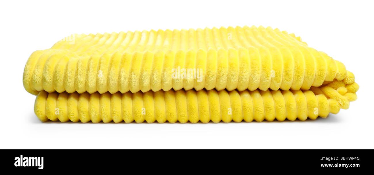 Folded yellow woolen blanket isolated on white Stock Photo