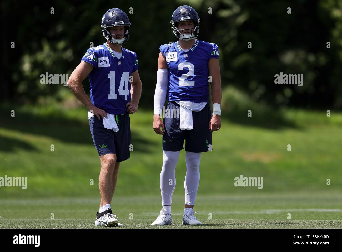 Seattle Seahawks quarterbacks Sam Darnold, left, and Drew Lock, watch ...