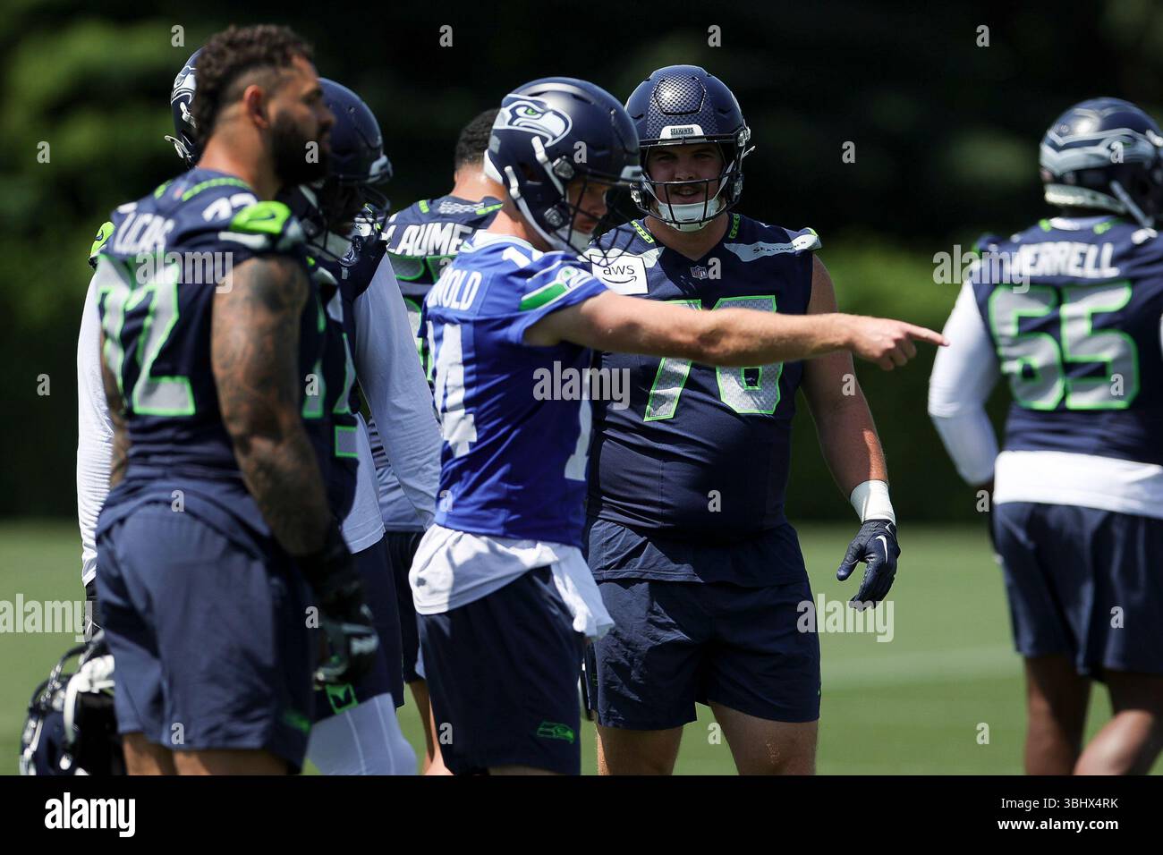 Seattle Seahawks guard Grey Zabel, right, listens as quarterback Sam ...