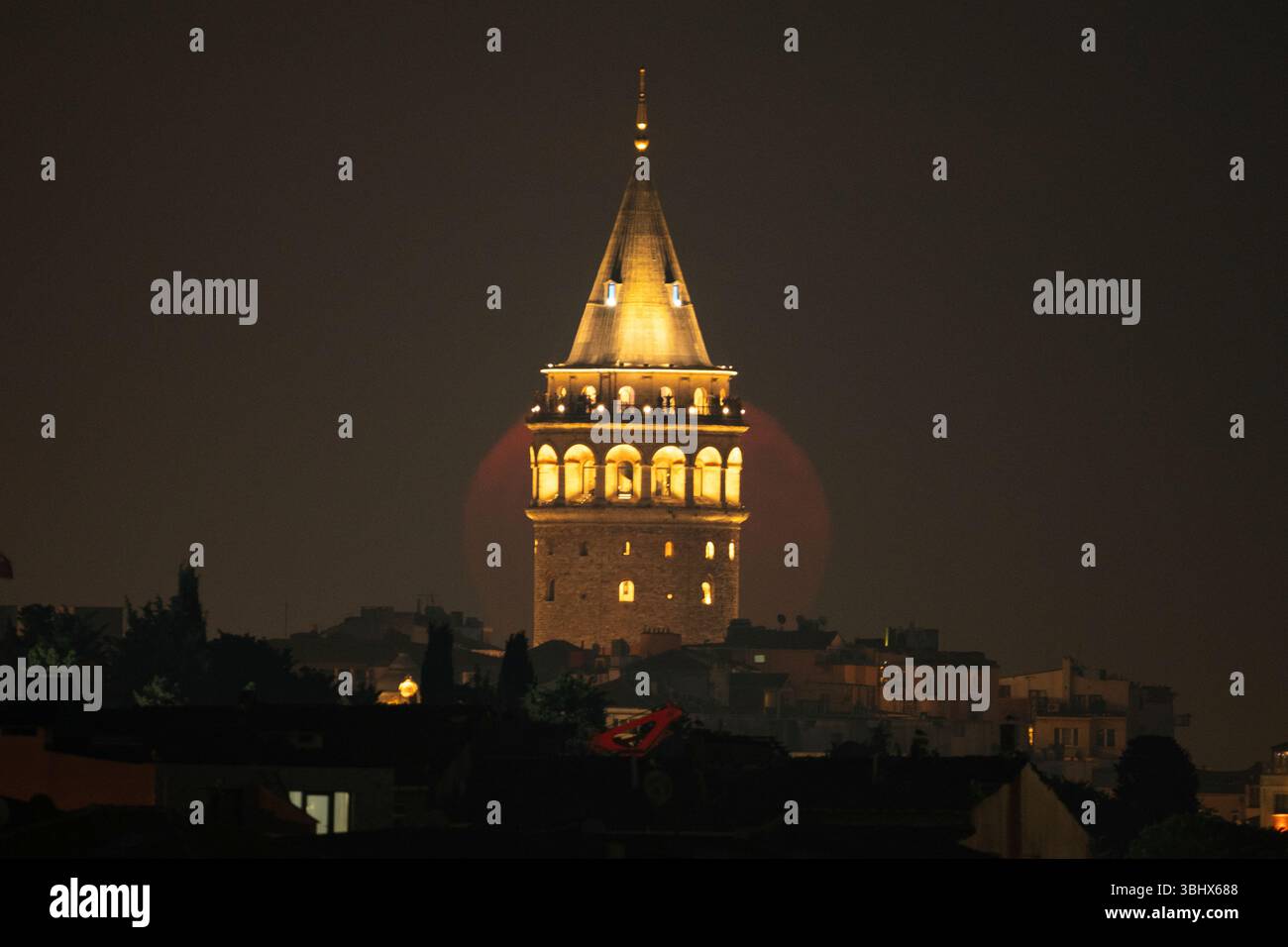 The strawberry Moon rises behind Galata Tower in Istanbul, Turkey ...