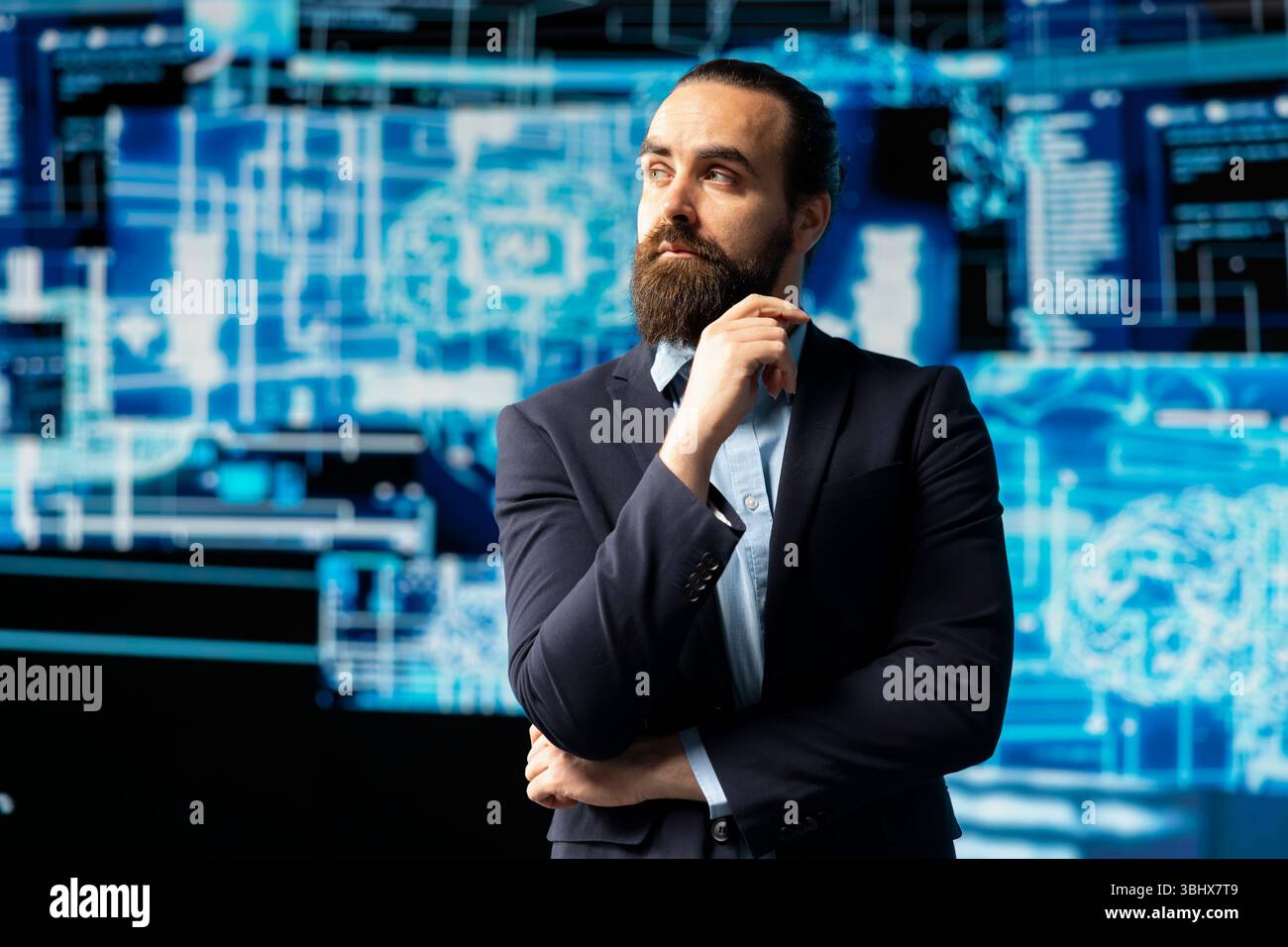 Young businessman studies artificial intelligence neural network on dashboards, using high tech automation tools for coding, analytics and machine learning for strategic development. Stock Photo