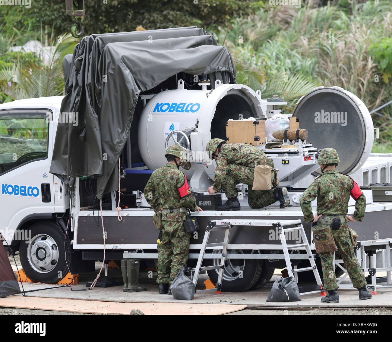 The Japan Ground Self-Defense Force members make unexploded ordnance ...