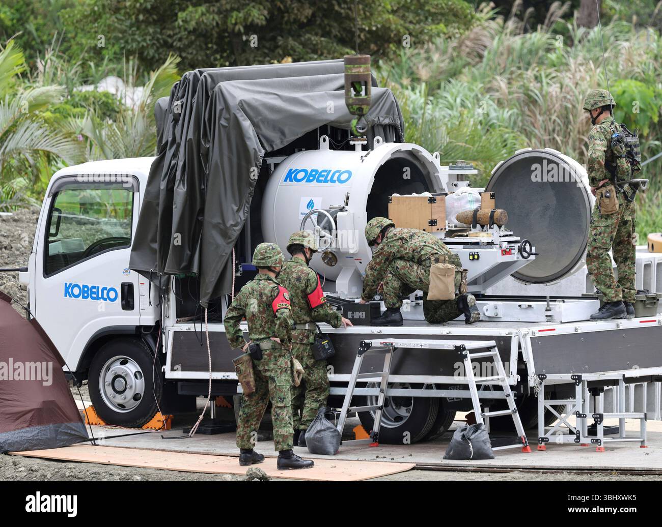The Japan Ground Self-Defense Force members make unexploded ordnance ...