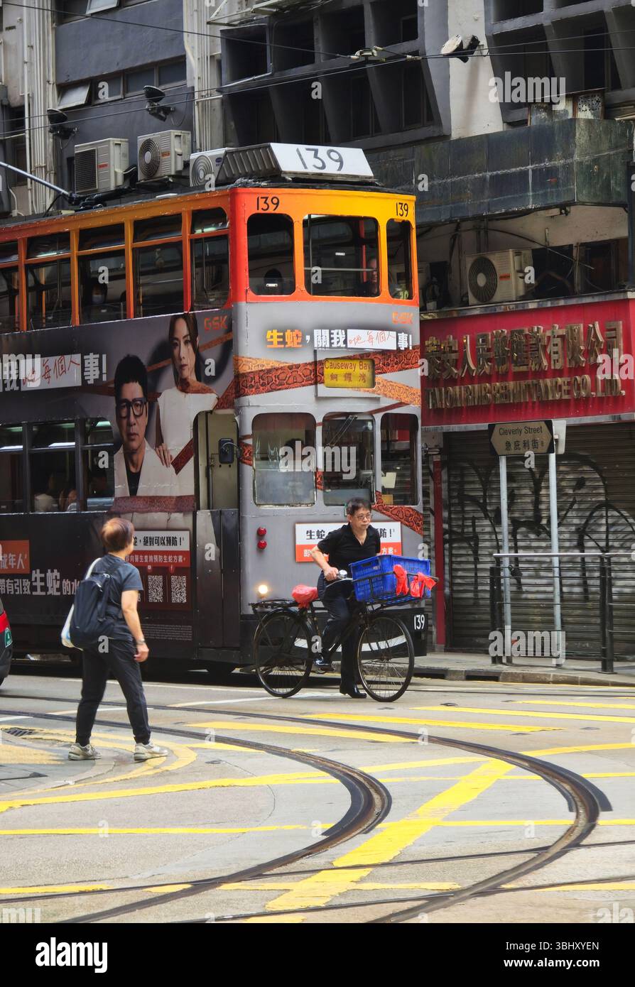 A tram at a traffic light in Sheung Wan, Hong Kong. - Smartphone Captured Stock Image