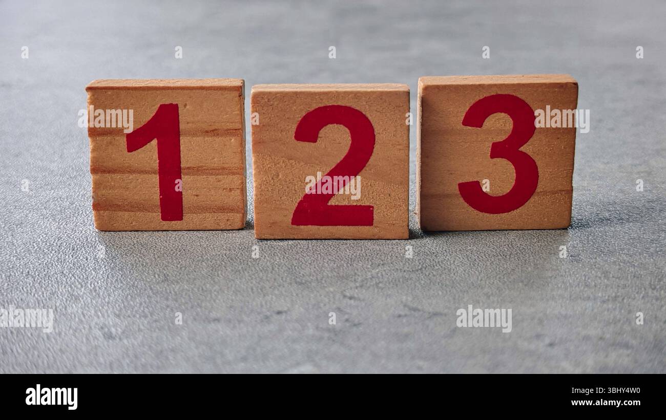 Wooden Number Blocks 1, 2, 3 Arranged on Gray Surface Stock Photo - Alamy