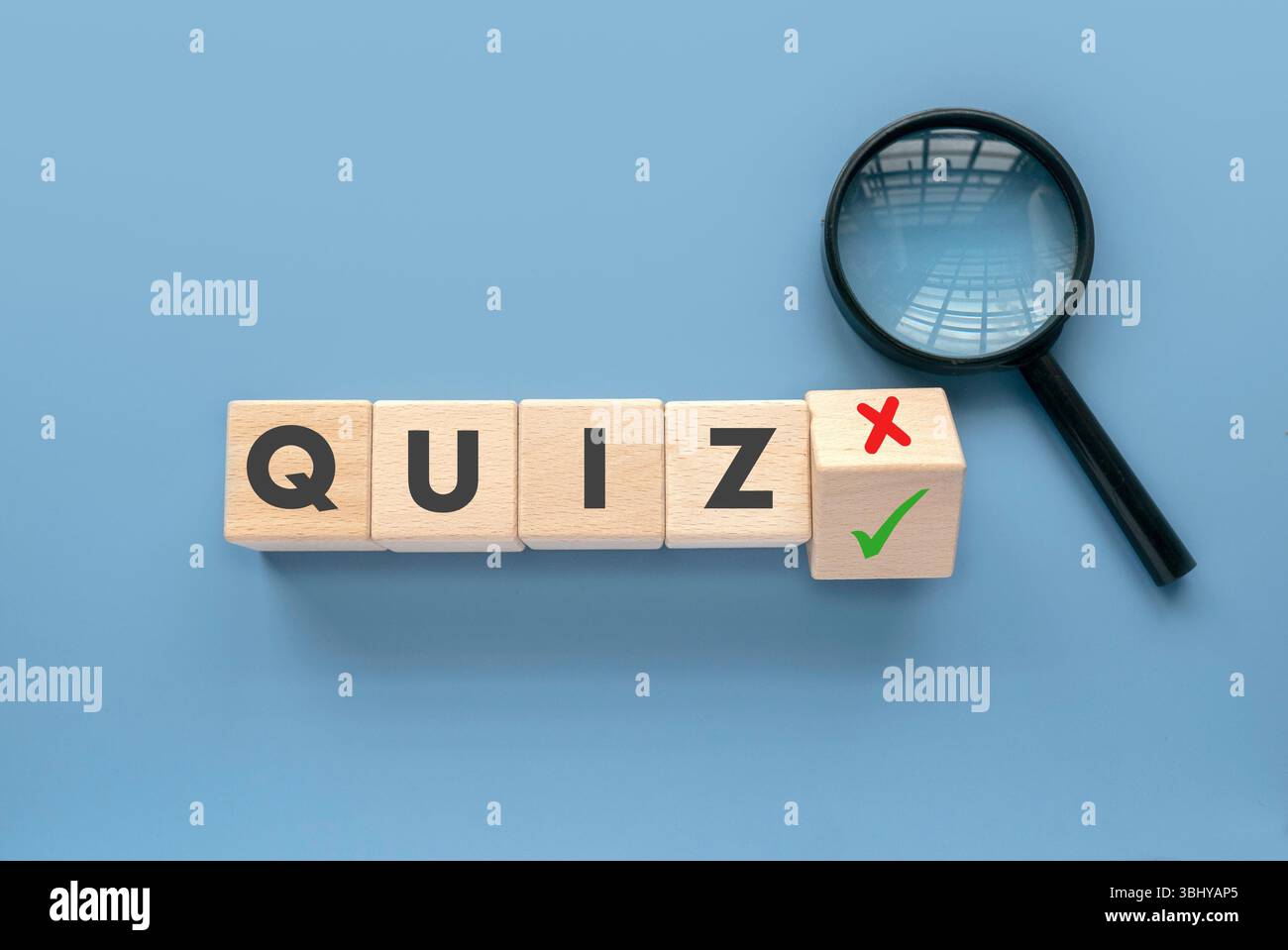 Quiz Concept with Wooden Blocks, Check Mark, Cross Mark, and Magnifying ...