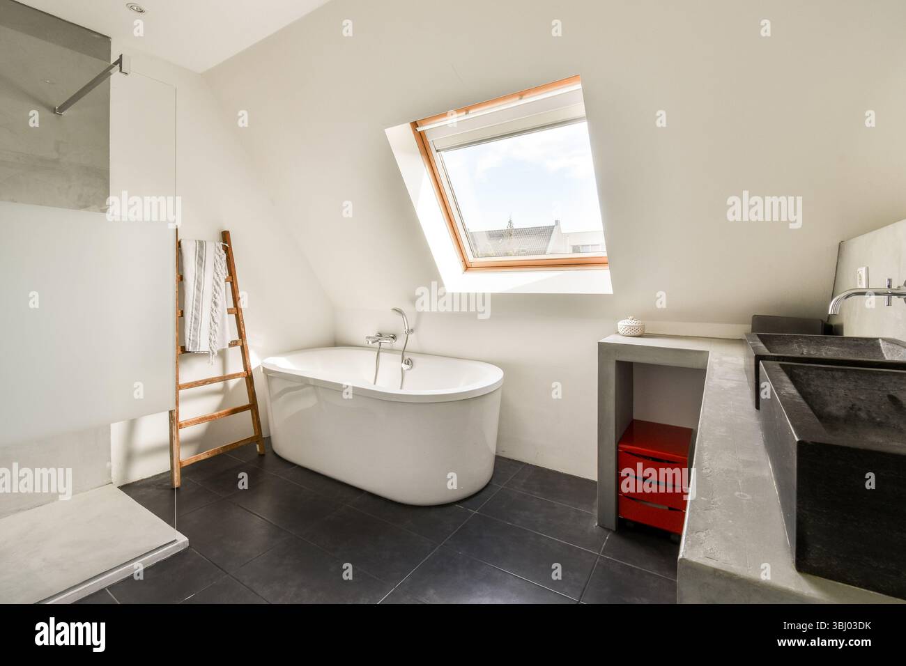 Picture of A sleek and modern bathroom featuring a freestanding tub, minimalist ...