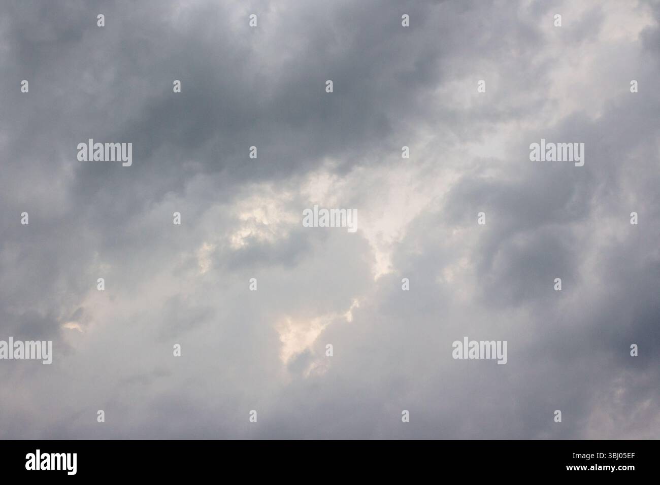 dark storm clouds on the sky. beautiful gray cloudscape before the rain. scenic environment of disaster climate. threatening evening forecast Stock Photo