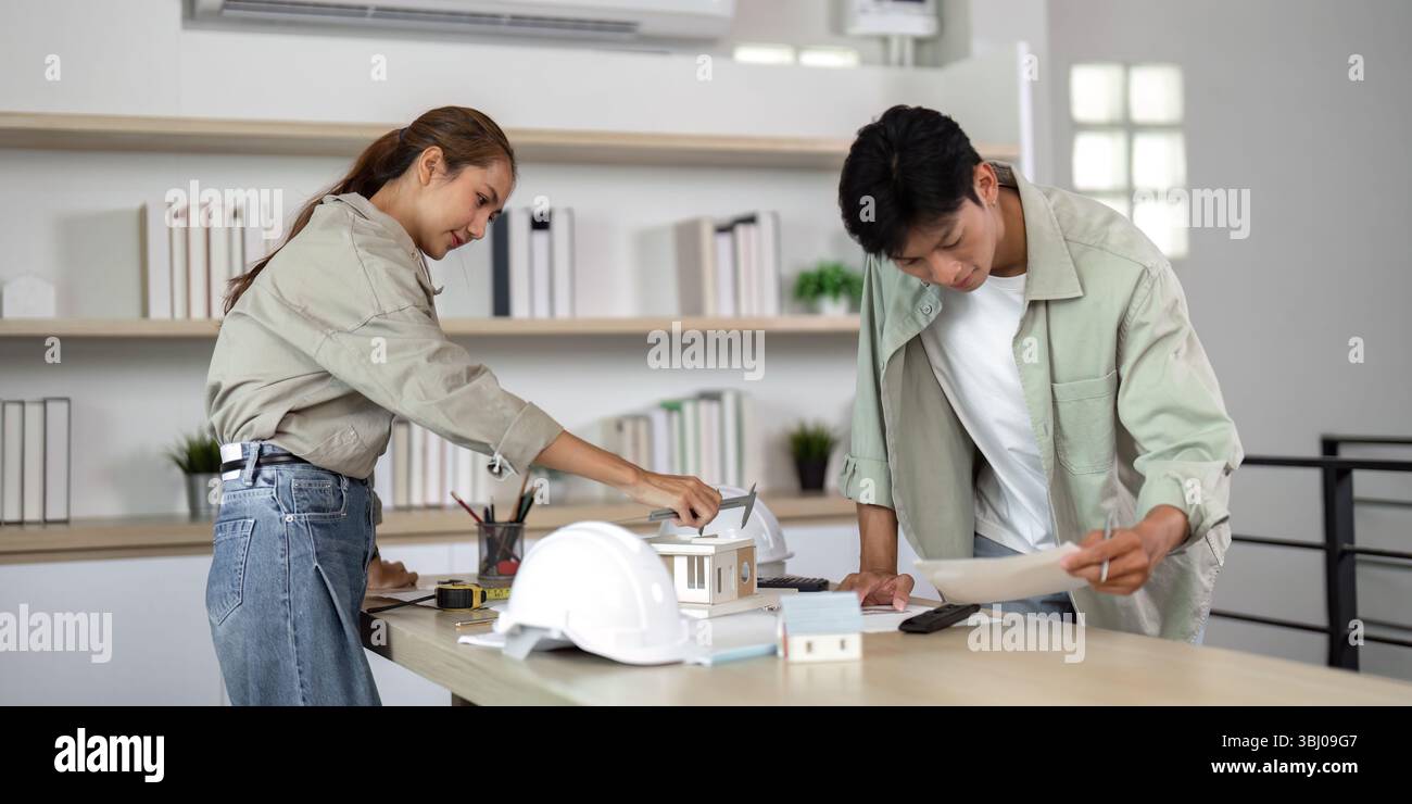Architects Collaborating on Sustainable Design Projects Stock Photo