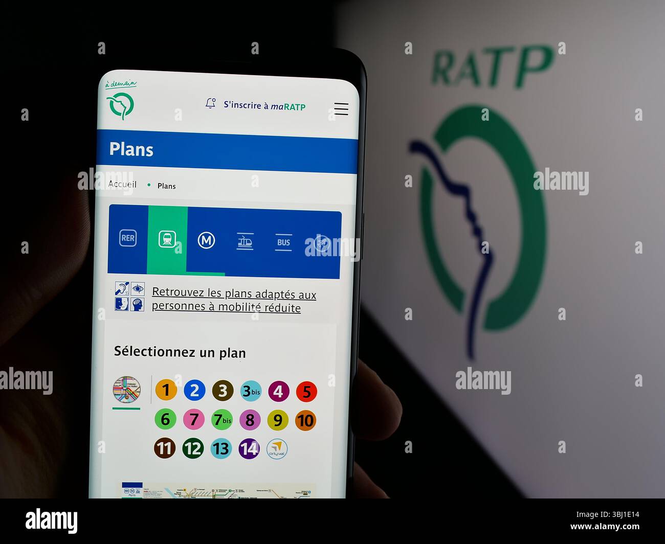 Stuttgart, Germany - 03-21-2025: Person holding smartphone with website of French public transport company RATP on screen in front of logo. Stock Photo