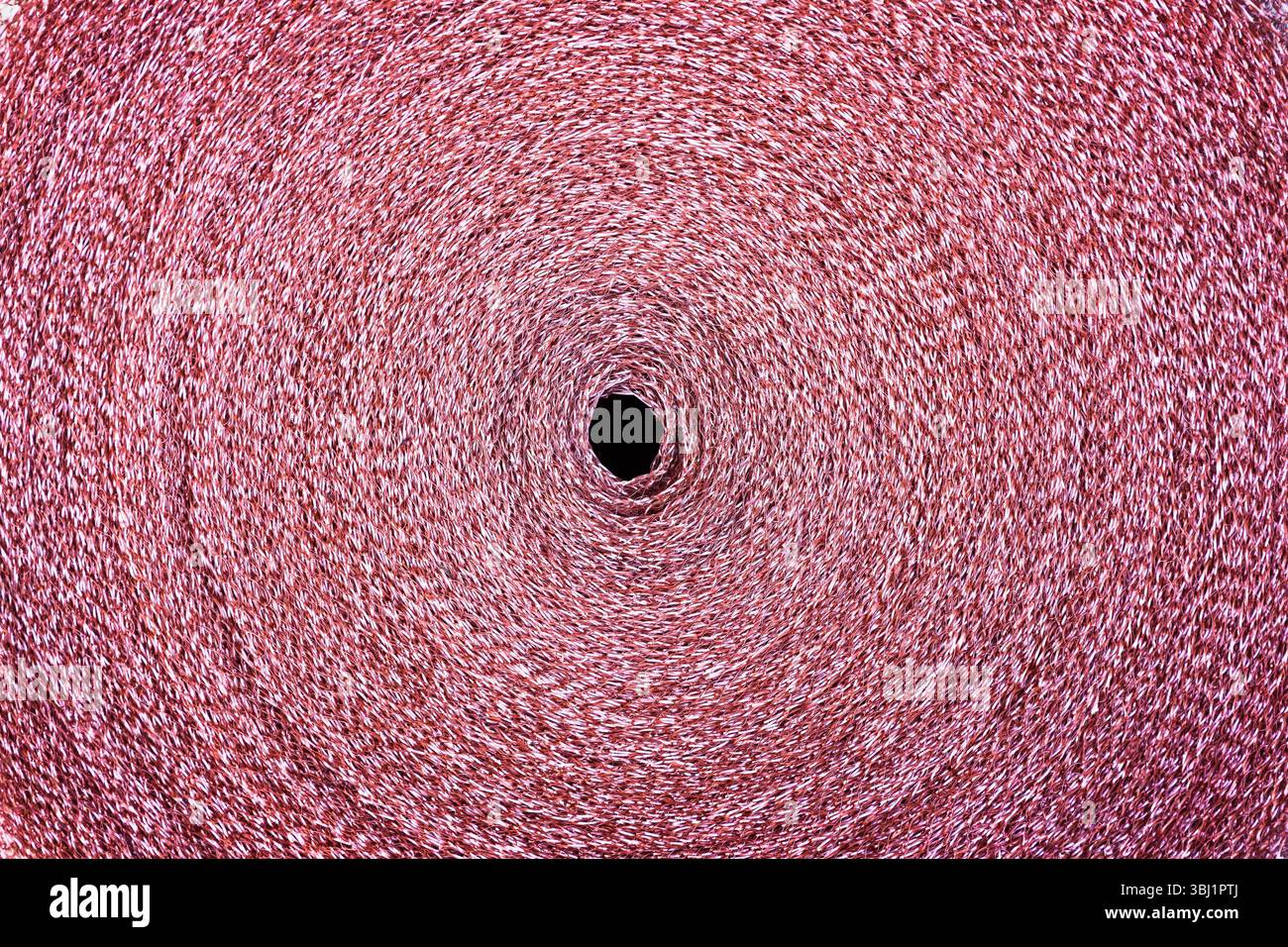 Copper mesh, twisted into a roll, top view. Stock Photo