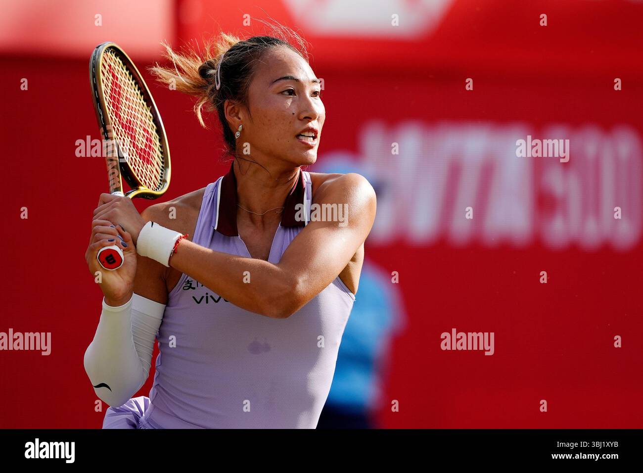 Qinwen Zheng in action during her match against Mccartney Kessler on