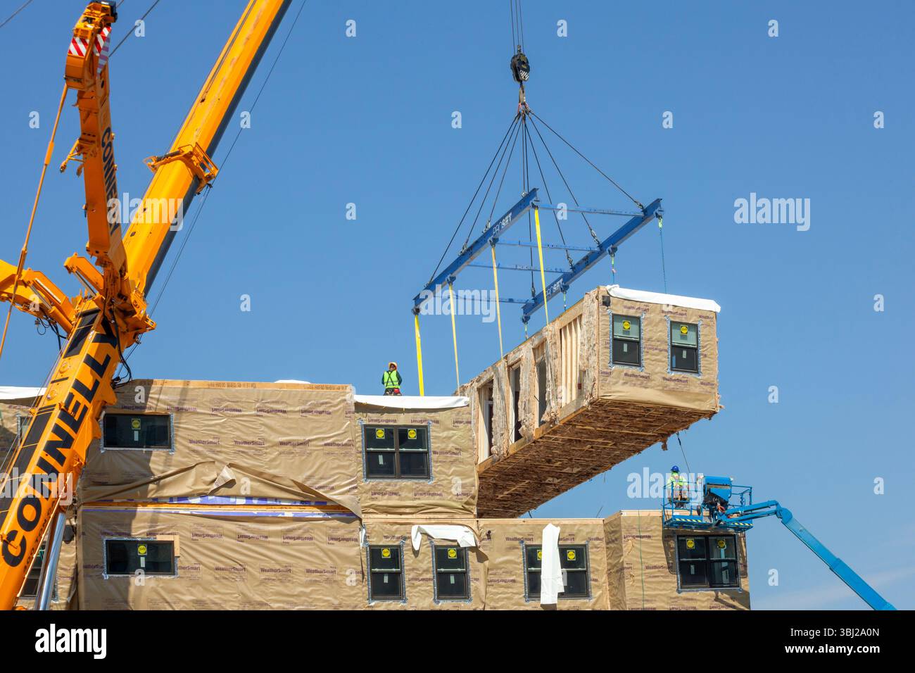 Moderate Build Detroit, Michigan - Workers use modular construction methods to build ...