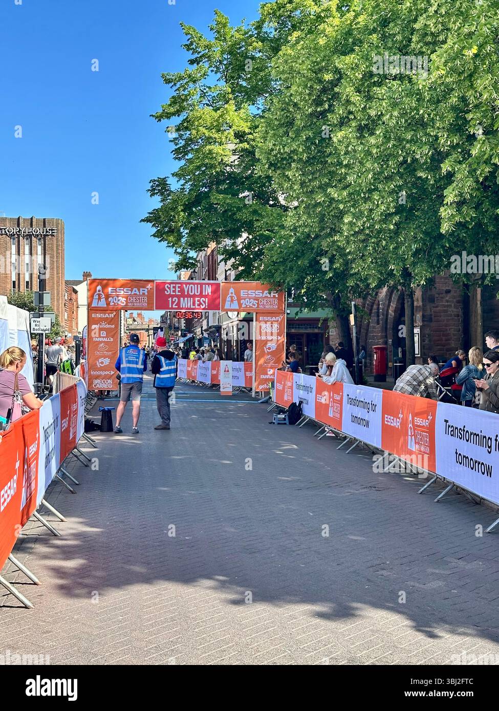 Chester Half Marathon finish line set up with stewards and spectators, Chester, Cheshire, England, 18 May 2025 - Smartphone Captured Stock Image