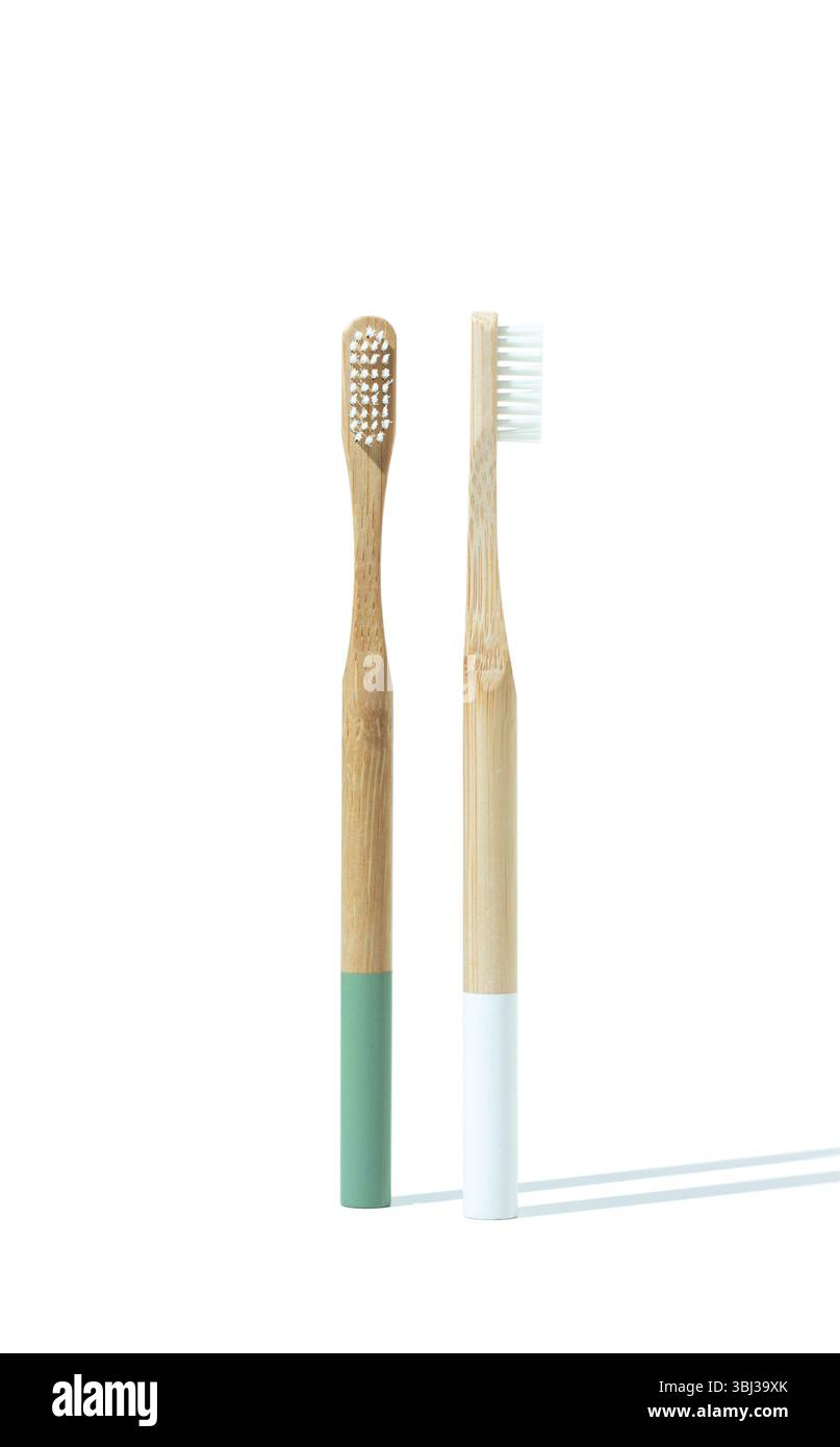 Two wooden toothbrushes on a white background for eco-friendly oral care Stock Photo