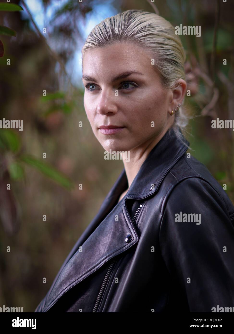 Young Woman Wearing Black Leather Jacket Forest Moody Stock Photo