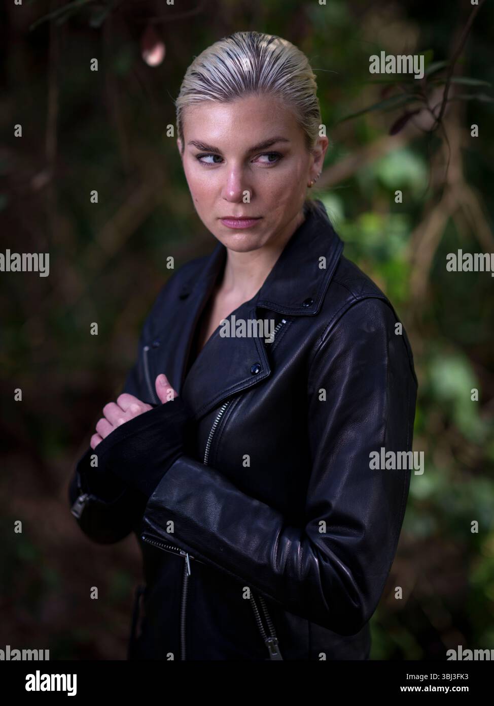 Young Woman Wearing Black Leather Jacket Forest Moody Stock Photo