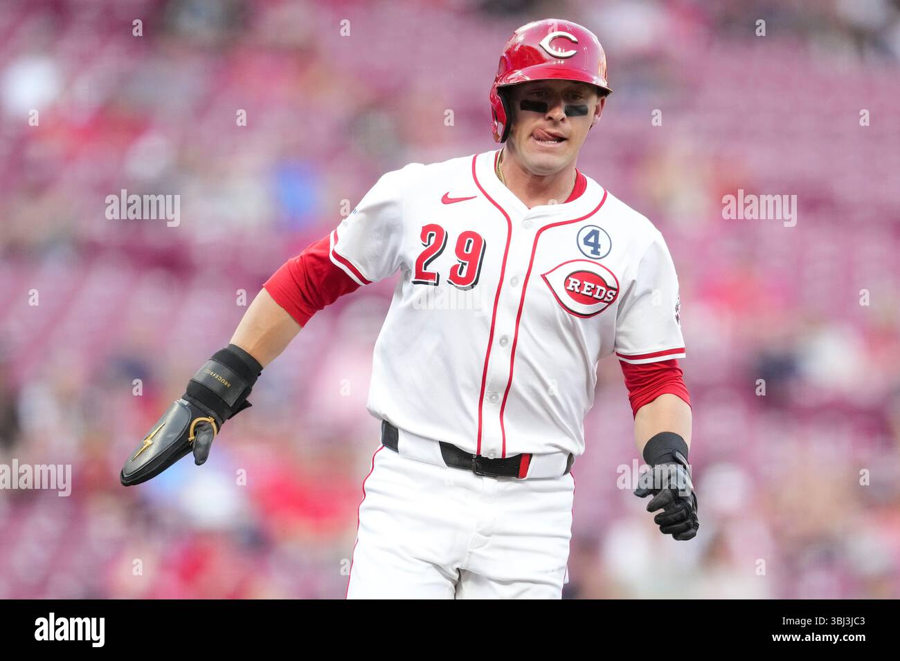 Cincinnati Reds' TJ Friedl (29) scores during a baseball game against