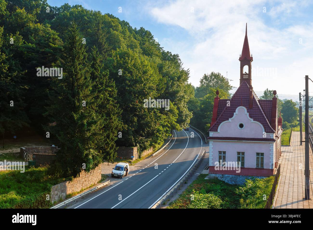 karpaty, zakarpattia/ukraine - jul 28, 2013: old railway station karpaty in morning light. historical building in carpathian mountains in summer. aust Stock Photo