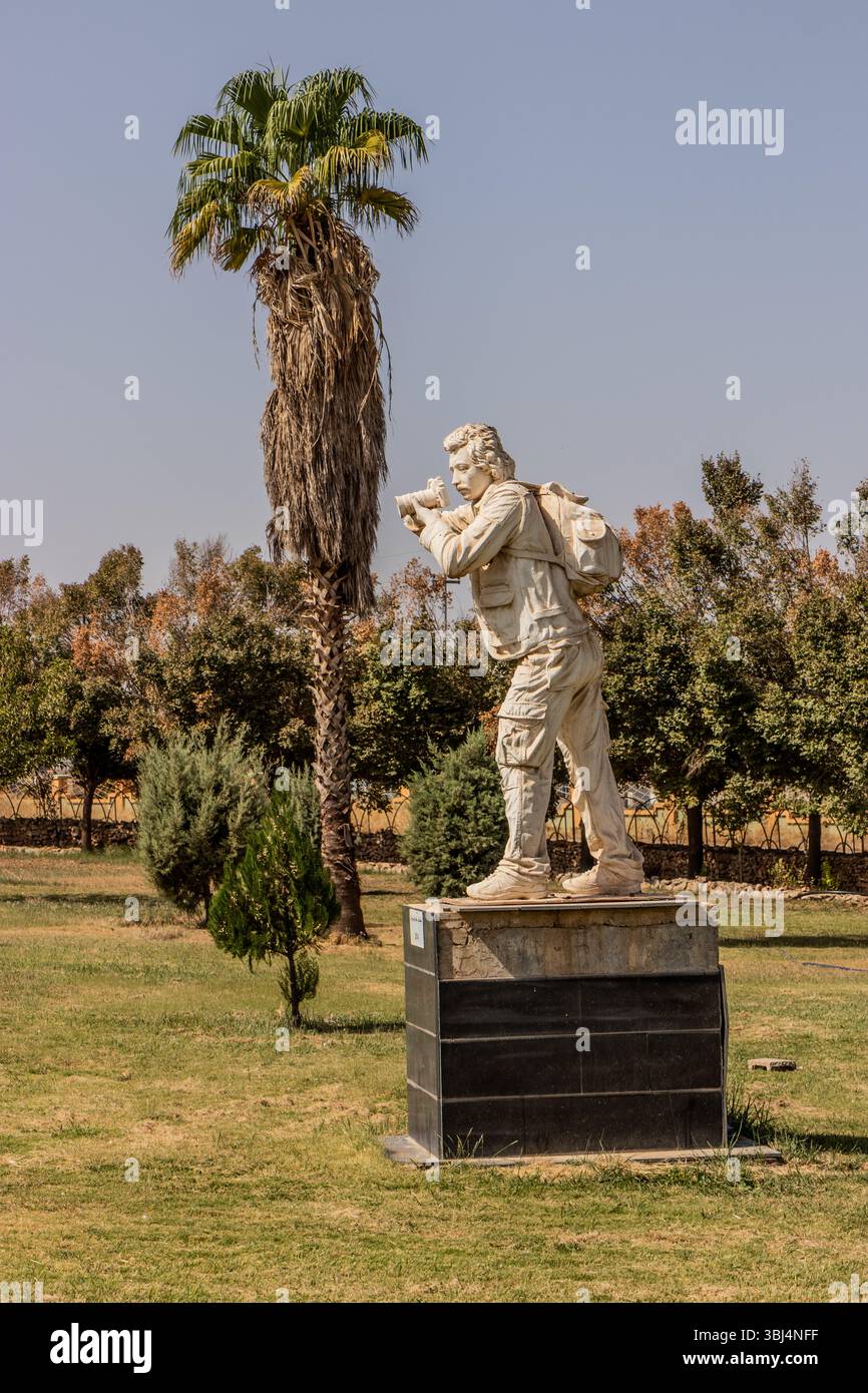 HALABJA, IRAQ - OCTOBER 6, 2022: Halabja Monument And Peace Museum grounds. Statue of journalist Kaveh Golestan covering the chemical attack in Halabj Stock Photo