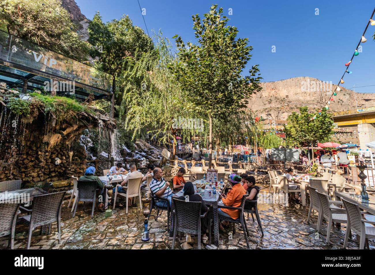 Bekhal Fall BEKHAL, IRAQ - OCTOBER 4, 2022: Tourists in a cafe near Bekhal ...