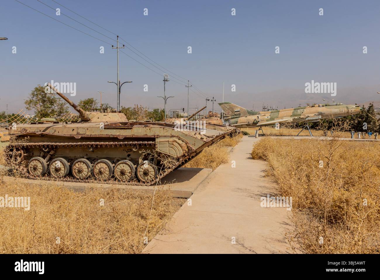Armored vehicles and Sukhoi Su-22 fighter-bomber at the grounds of ...