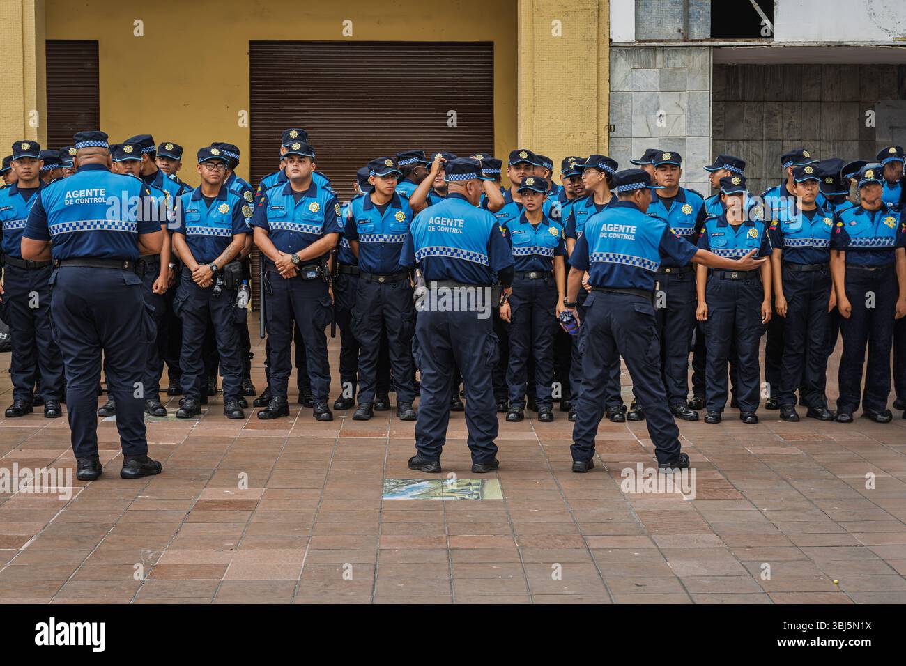 Guayaquil, Ecuador — January 21, 2025. Ecuadorian police officers stand at attention in uniform while listening to their commanding officers. Stock Photo