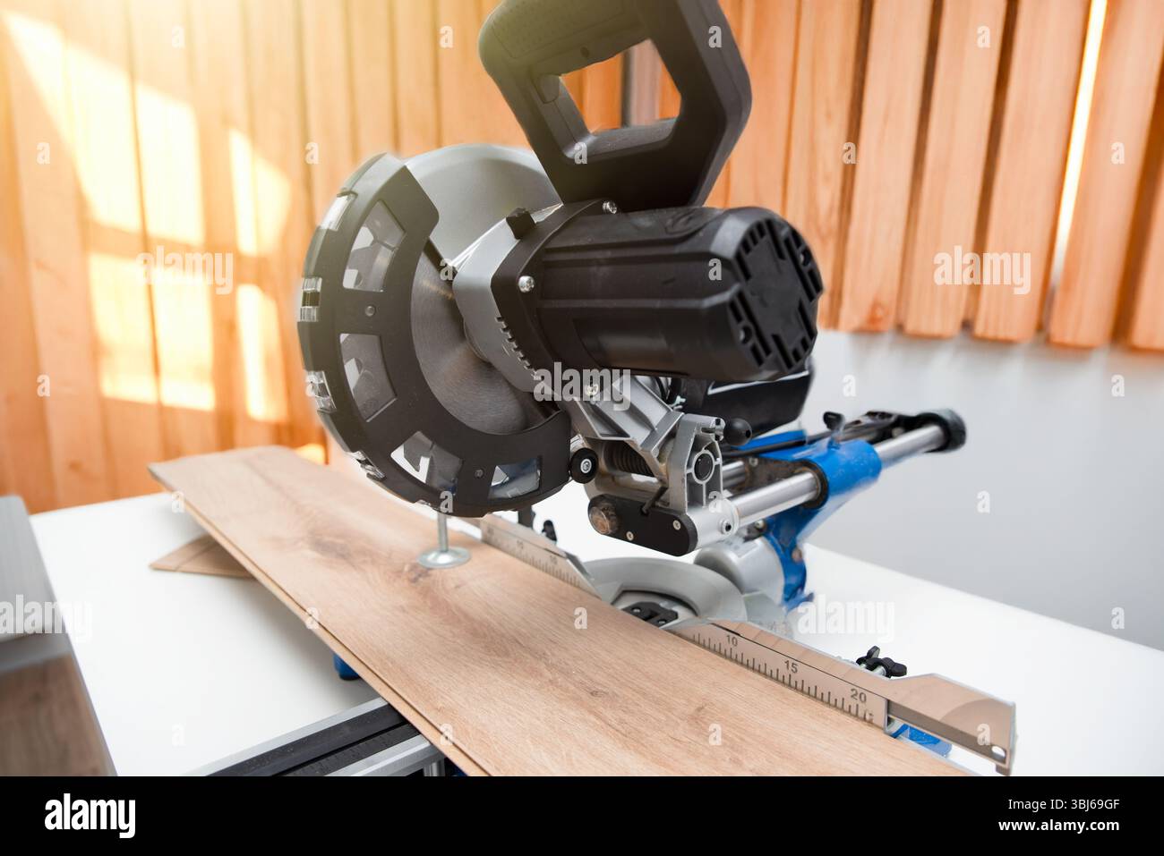 Miter saw while working on flooring panels, laminate flooring Stock ...