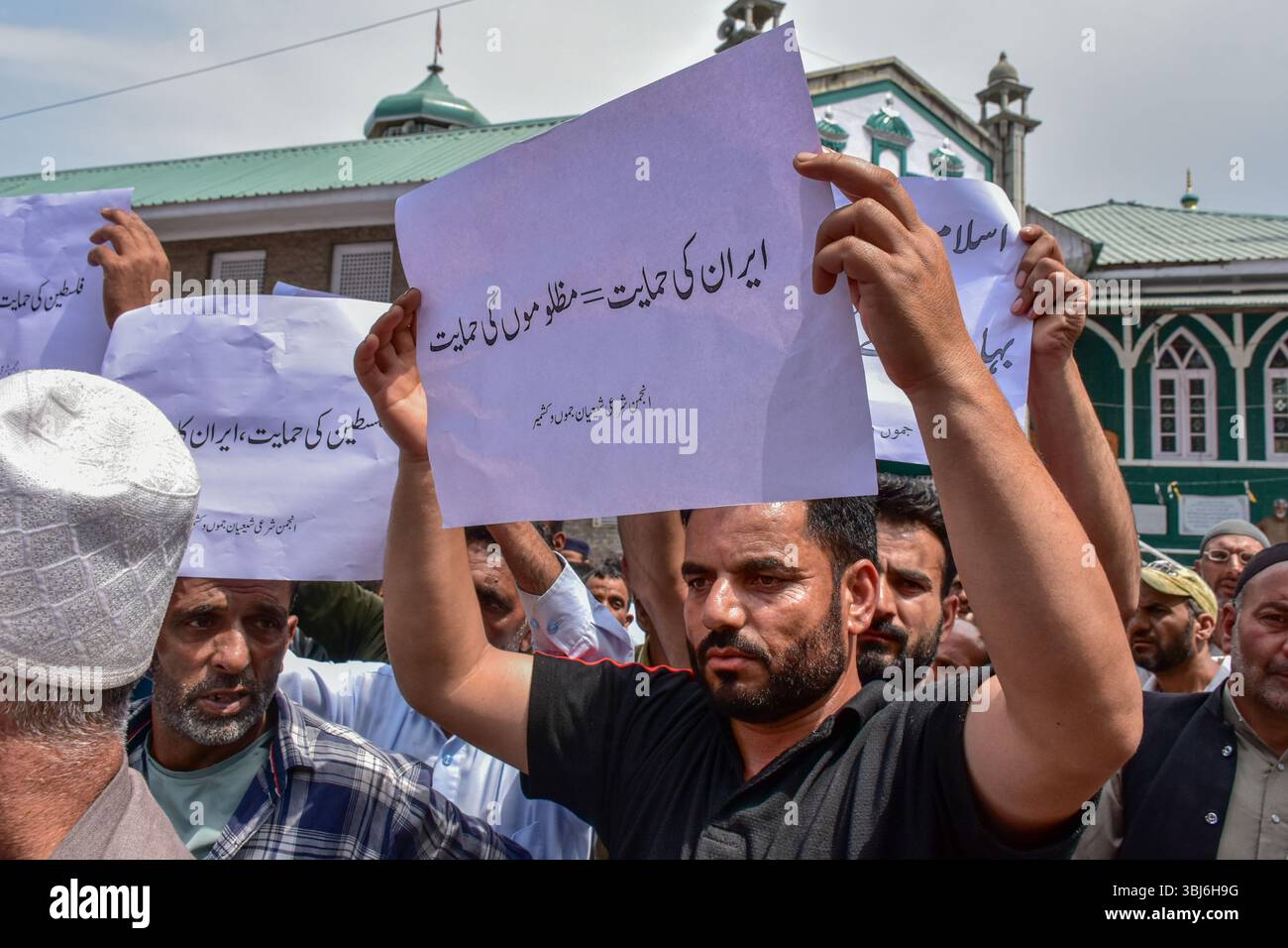 A Kashmiri Shiite Muslim holds a placard during a protest rally in ...