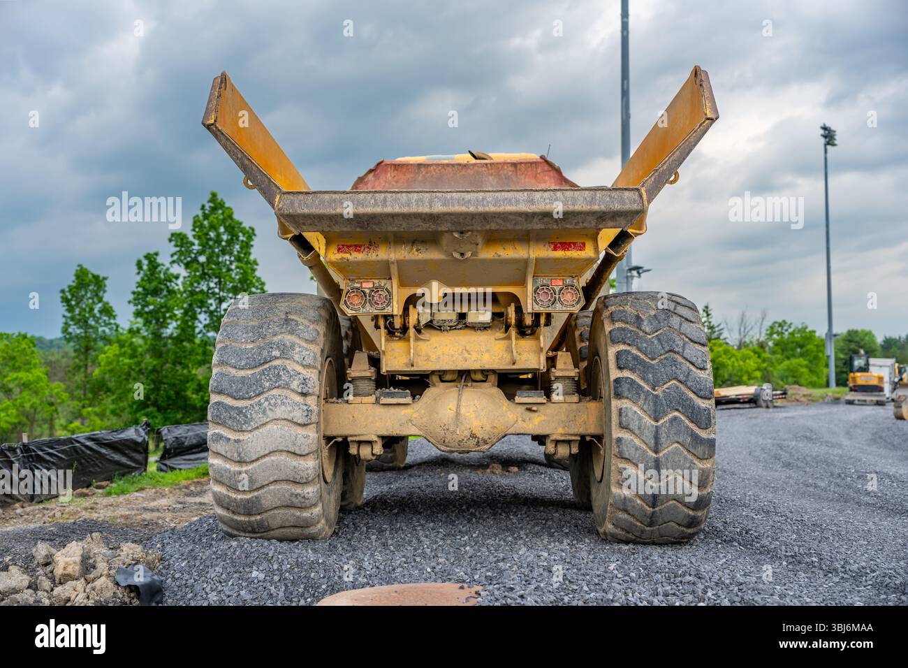 Back of an empty large industrial dump truck on a construction site ...