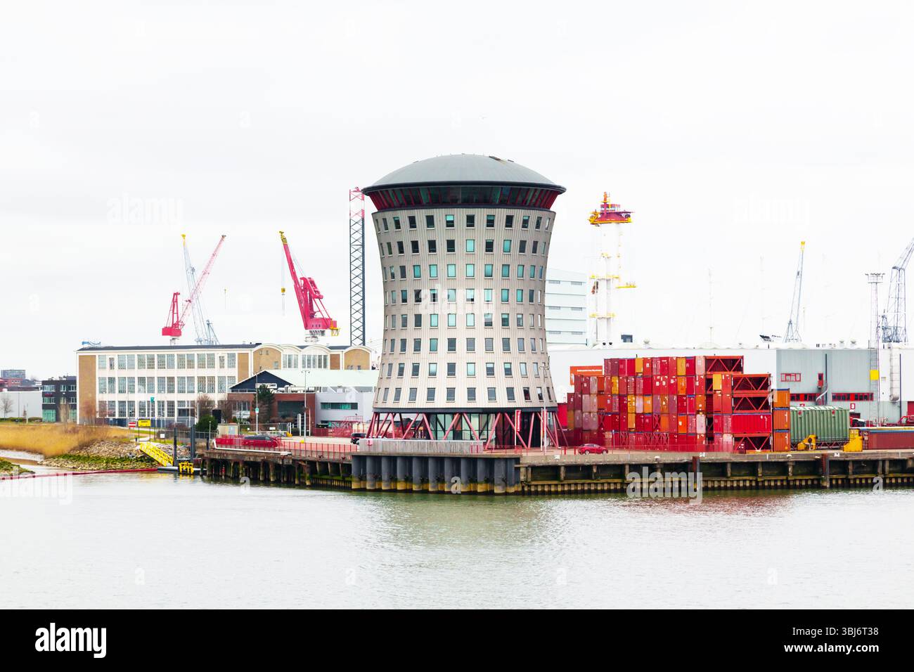 Sea port in Rotterdam with a pilot observation tower and containers on ...