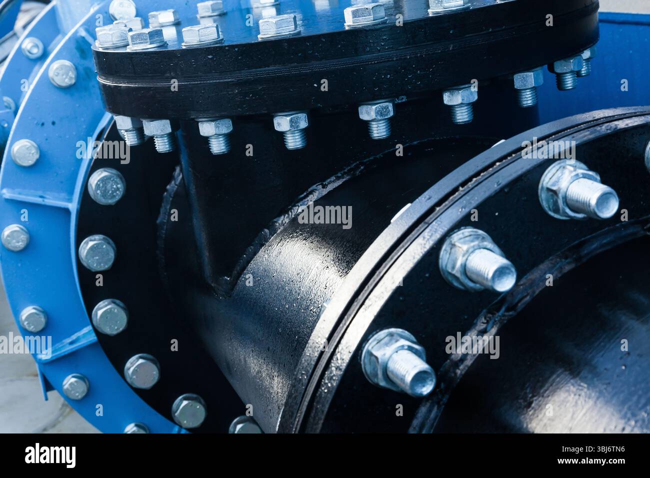 Large pipe connection with a large number of bolts and nuts enclosed on ...