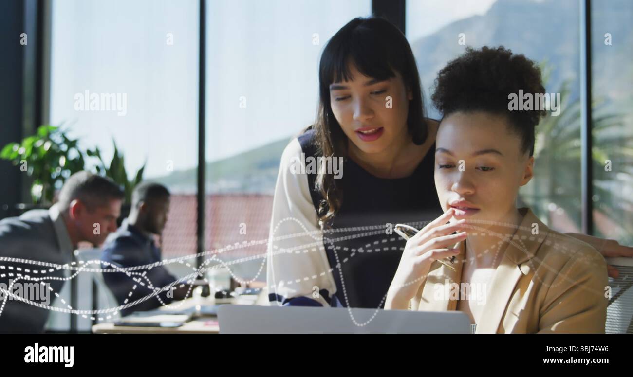 Team collaborating table pointing laptop hi-res stock photography and ...