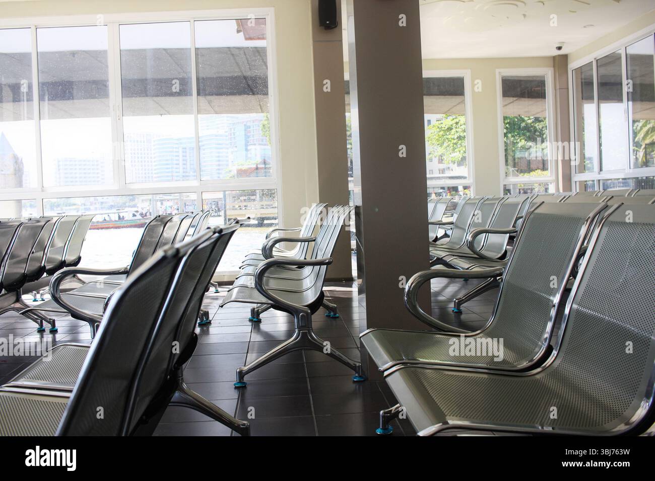 Waiting area with metal chairs in station, or bank, office, hospital ...