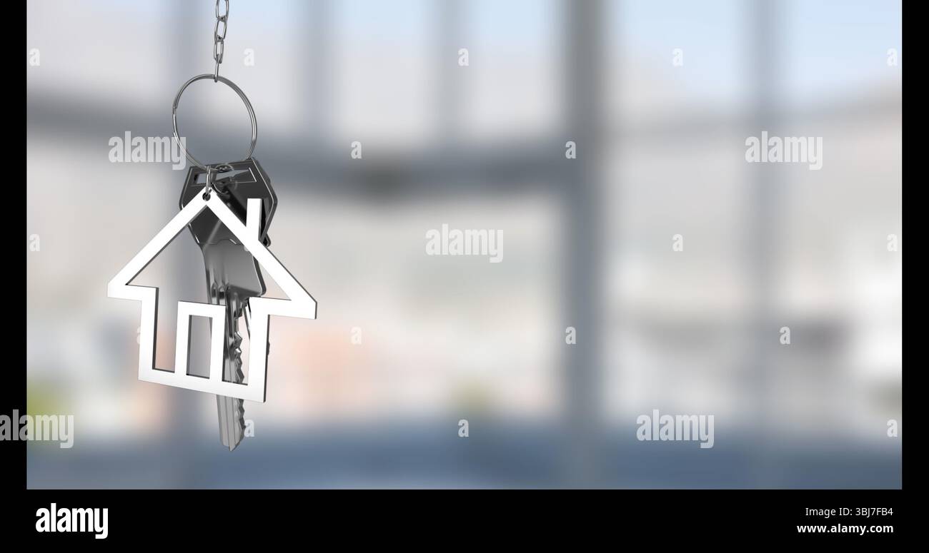 Displaying silver keyring holding house keychain and two keys in empty room, with diffused light Stock Photo
