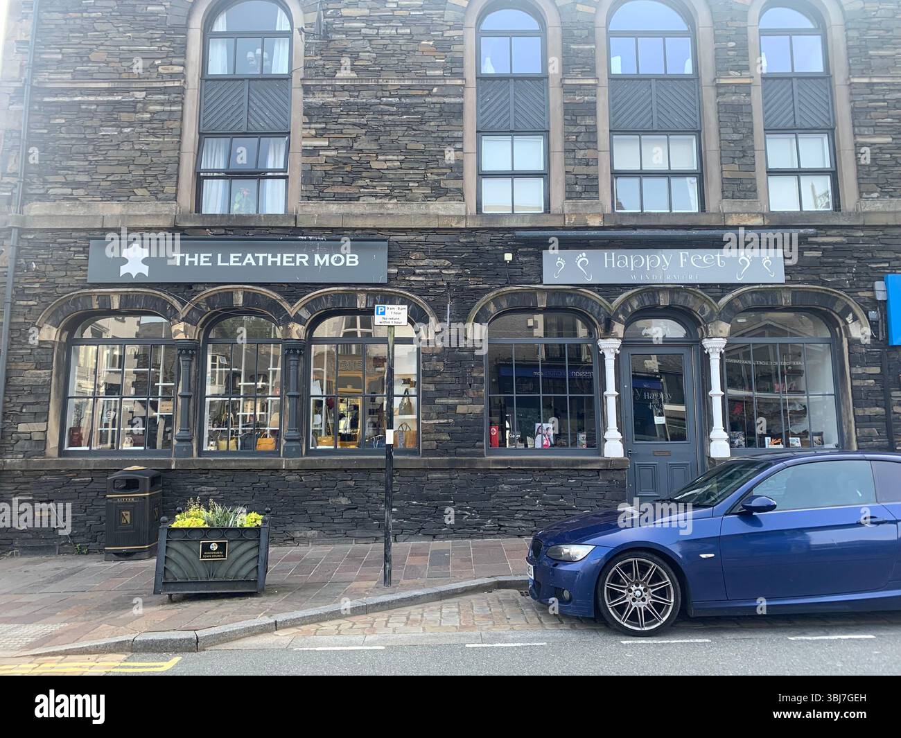 Lake Windermere shop shops town visit old historic history water pond outside people sit sat house houses pub beer eat food dinning rent hotel tourist - Smartphone Captured Stock Image