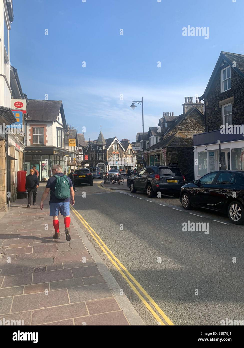 Lake Windermere shop shops town visit old historic history water pond outside people sit sat house houses pub beer eat food dinning rent hotel tourist - Smartphone Captured Stock Image
