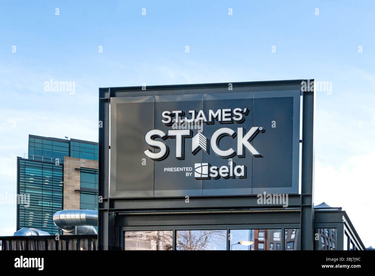 Outdoor signage of St James' Stack presented by Sela a container retail village and a  modern architectural background newcastle upon tyne Stock Photo